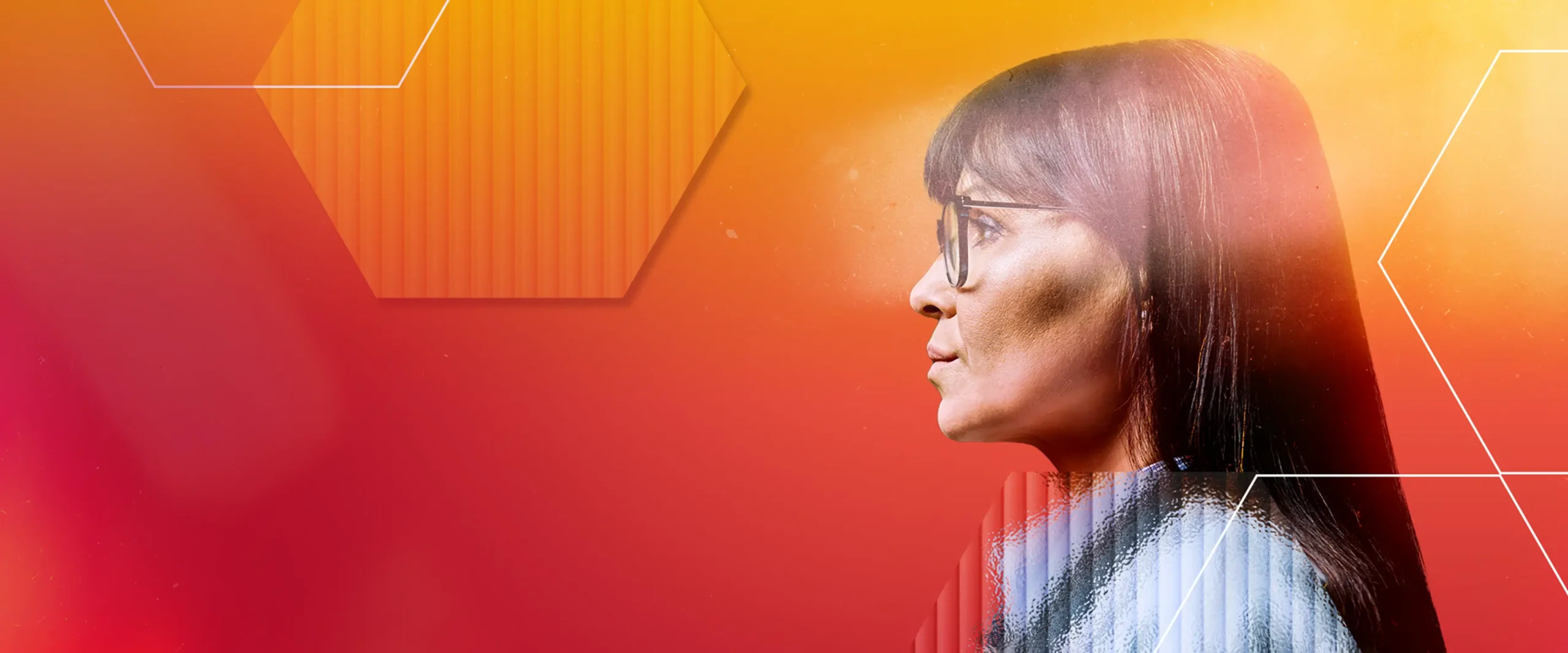 Profile of a person with long dark hair and glasses against a vibrant background of red, orange, and yellow gradients with geometric shapes.