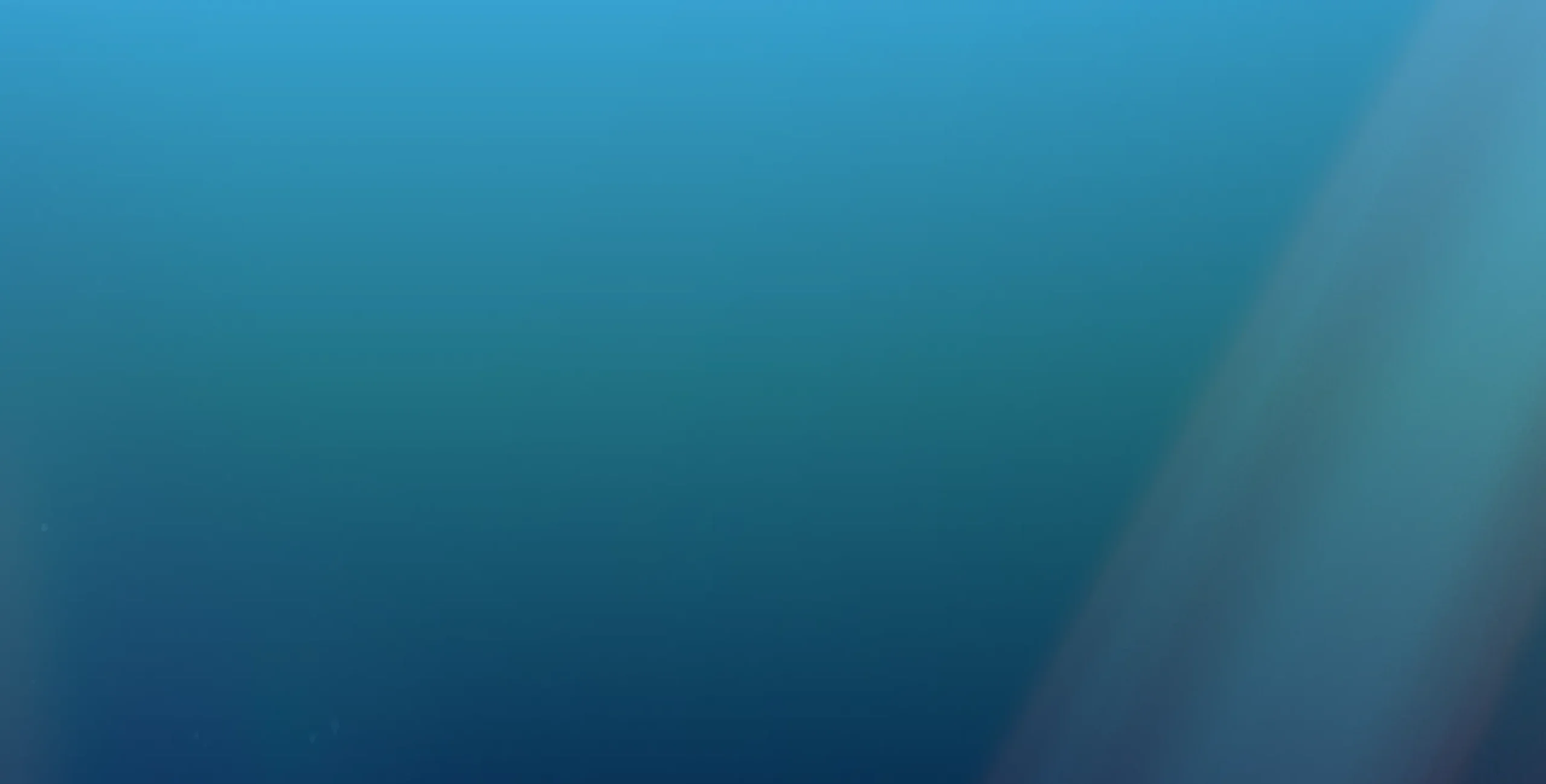 A smooth blue gradient background transitioning from light blue at the top to darker blue at the bottom, with a soft diagonal streak of even lighter blue on the right side.