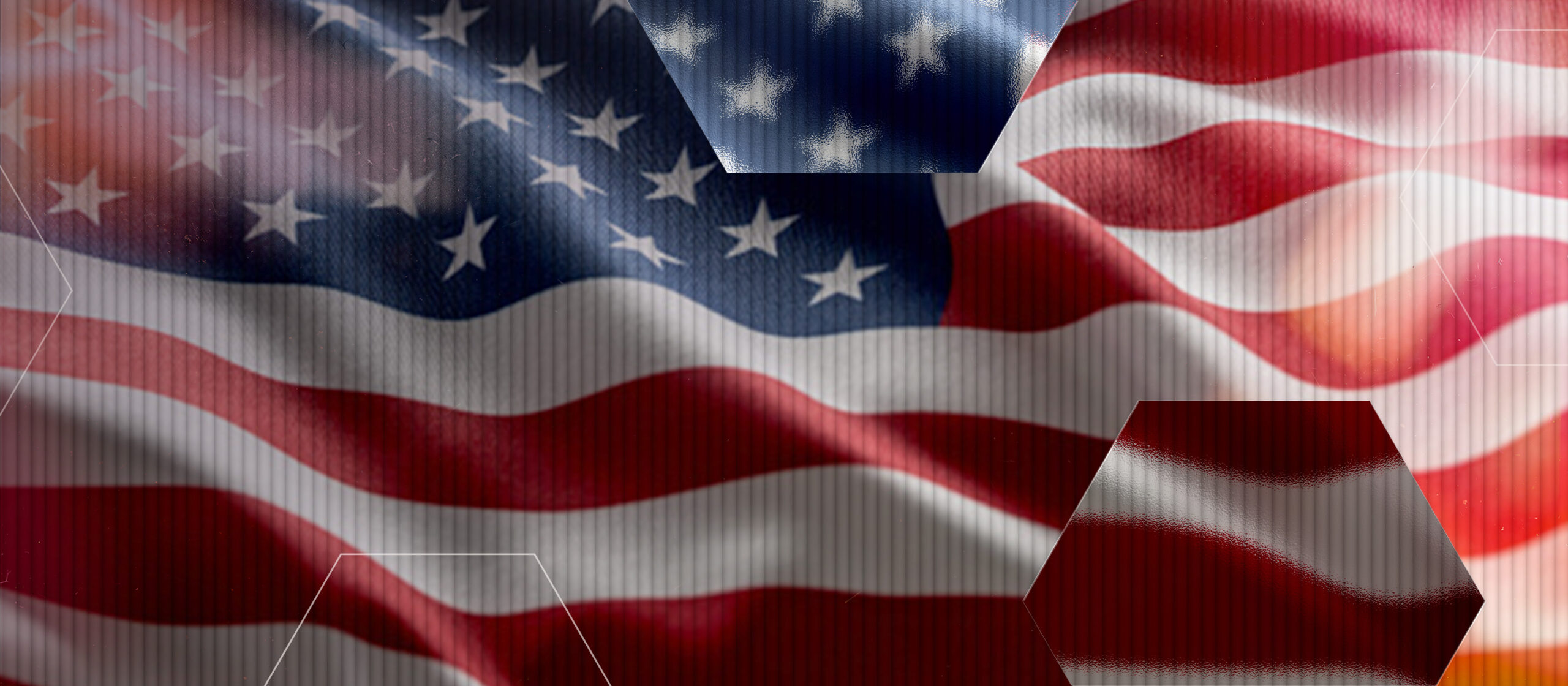 A close-up of the United States flag with visible red and white stripes and white stars on a blue field. Semi-transparent hexagonal shapes overlay parts of the flag.