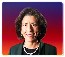 A woman with short dark hair, wearing a dark blazer, white beaded necklace, and hoop earrings, smiles in front of a purple and red gradient background.