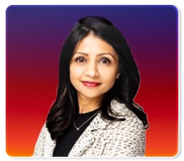 A woman with long dark hair, wearing a light patterned blazer and black top, smiles in front of a purple and red gradient background.